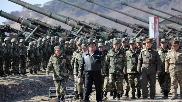 epa11205696 A photo released by the official North Korean Central News Agency (KCNA) shows North Korean Supreme leader Kim Jong Un (C) presiding over an artillery firing drill involving large combined units from the Korean People's Army (KPA), at an undisclosed location in North Korea, 07 March 2024 (issued 08 March 2024). According to KCNA, the drill was conducted to increase combat readiness and actuall warfighting capabilities of participating artillery units. The drill took place as South Korea and the USA continue their annual 11-day Freedom Shield military excercises. EPA/KCNA EDITORIAL USE ONLY EDITORIAL USE ONLY