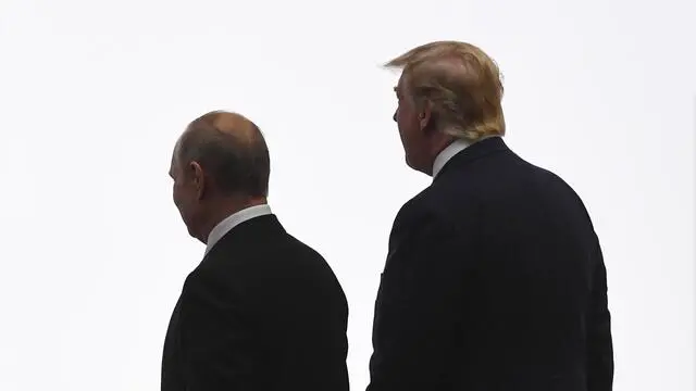 epa07679518 US President Donald J. Trump (R) and Russian President Vladimir Putin arrive for the Leaders family photograph at the G20 leaders summit in Osaka, Japan, 28 June 2019. The leaders of the world's largest economies gathered in Osaka for the fourteenth meeting of Group of Twenty (G20). EPA/LUKAS COCH AUSTRALIA AND NEW ZEALAND OUT