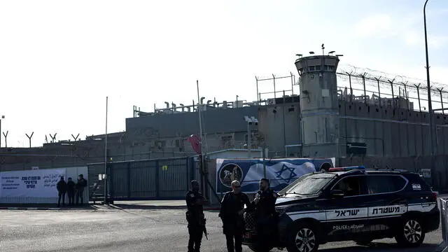 epa11850988 Israeli police officers stand outside the West Bank's Ofer military prison ahead of the expected release of Palestinian prisoners in the Israel-Hamas release deal, north of Jerusalem, 25 January 2025. Israel and Hamas implemented the first phase of a hostage release and ceasefire deal on 19 January 2025. More than 46,000 Palestinians have been killed in the Gaza Strip, according to the Palestinian Ministry of Health, since Israel launched a military campaign in the strip in response to a cross-border attack led by the Palestinian militant group Hamas on 07 October 2023, in which about 1,200 Israelis were killed and more than 250 taken hostage. EPA/ATEF SAFADI