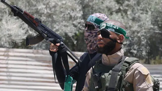 epa11455044 Palestinian gunmen attend the funeral of four members of Islamic Jihad who were killed by an Israeli airstrike late Tuesday, during their funeral in the West Bank refugee camp of Nur Shams near Tulkarem 03 July 2024. At least four people were killed in an Israeli airstrike at Nour Shams camp, near the West Bank city of Tulkarem, according to the Palestinian Ministry of Health. EPA/ALAA BADARNEH