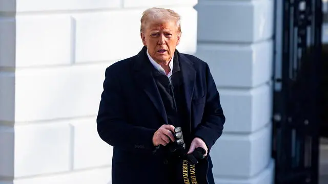 epa11849802 US President Donald Trump approaches reporters as he departs the White House for North Carolina, where he is expected to tour hurricane damage, followed by a visit to tour fire damage in Los Angeles, in Washington, DC, USA, 24 January 2025. Trump spoke about the upcoming Congressional vote on his nominee for Department of Defense Hegseth. EPA/JIM LO SCALZO