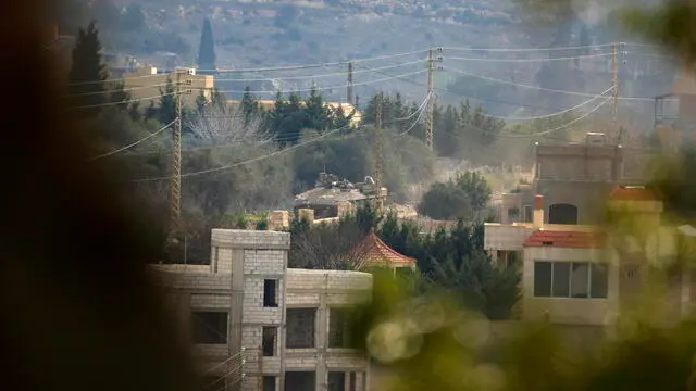 epa11854859 An Israeli tank positioned in Meiss al-Jabal, Marjayoun District, southern Lebanon, 26 January 2025. According to the Lebanese Ministry of Health more than a dozen people were killed when the Israeli army reportedly fired at Lebanese attempting to return to their villages in southern Lebanon. EPA/STR