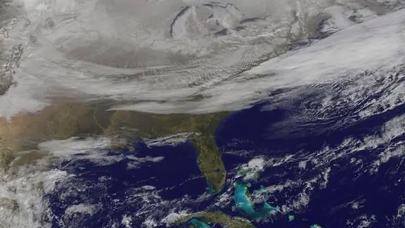 epa04550976 A handout photo provided 08 January 2015 by the National Aeronautics and Space Administration (NASA), NOAA's GOES-East satellite providing a look at the frigid eastern two-thirds of the U.S. on 07 January 2015, that shows a blanket of northern snow, lake-effect snow from the Great Lakes and clouds behind the Arctic cold front. A visible picture captured at 11 a.m. EST showed the effects of the latest Arctic outbreak. The cold front that brought the Arctic air moved as far south as Florida, and stretched back over the Gulf of Mexico and just west of Texas. The image shows clouds behind the frontal boundary stretching from the Carolinas west over the Heartland. Farther north, a wide band of fallen snow covers the ground from New England west to Montana, with rivers appearing like veins. The GOES-East satellite image also shows wind-whipped lake-effect snows off the Great Lakes, blowing to the southeast. Meanwhile, Florida, the nation's warm spot appeared almost cloud-free. EPA/NASA / NOAA GOES Project / HANDOUT HANDOUT EDITORIAL USE ONLY