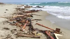 The remains of the boat carrying the migrants at a beach near Cutro, Crotone province, southern Italy, 26 February 2023. Italian authorities recovered at least 40 bodies on the beach and in the sea near Crotone, in the southern Italian region of Calabria, after a boat carrying migrants sank in rough seas near the coast. About forty people survived the accident, Authorities fear the death toll will climb as rescuers look for survivors. ANSA/ GIUSEPPE PIPITA