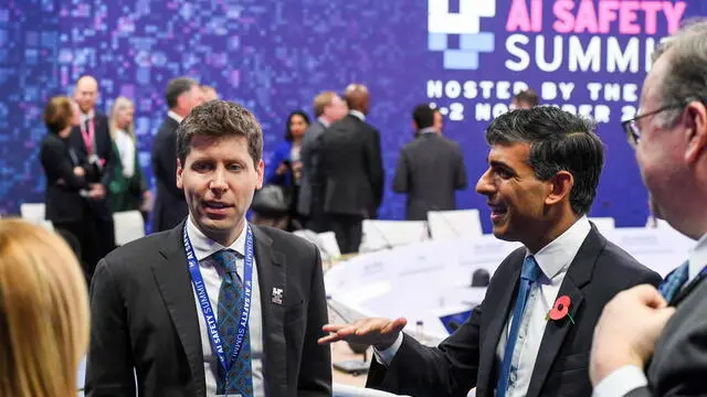 epa10954735 OpenAI CEO Sam Altman (L) talks to British Prime Minister Rishi Sunak (C) ahead of a plenary session on day two of the AI Safety Summit 2023 at Bletchley Park, Milton Keynes, Britain, 02 November 2023. The summit, organised by the UK Government, considers the risks of AI and how they can be mitigated through internationally coordinated action, and is running from 01 to 02 November 2023. EPA/CHRIS J. RATCLIFFE / POOL