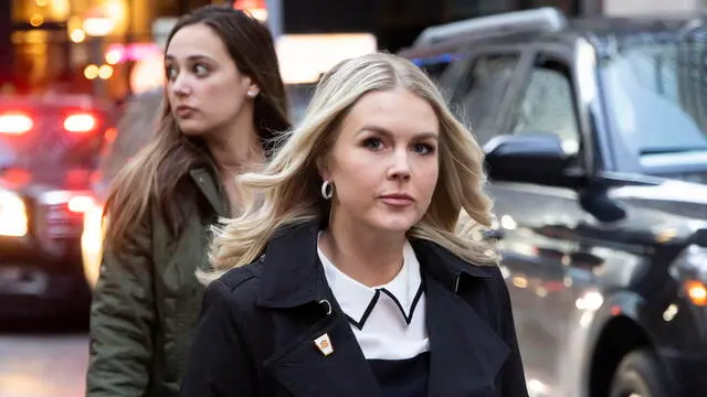 epa11772559 Karoline Leavitt (R), President-elect Donald Trump's pick for White House press secretary, arrives to attend Trump's visit to ring the Opening Bell at the New York Stock Exchange, in New York, New York, USA, 12 December 2024. President-elect Trump has been recognized as the 'Person of the Year' by the Time magazine. EPA/JUSTIN LANE