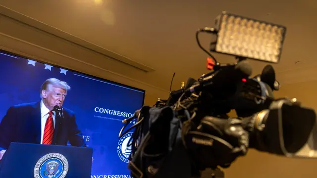 epa11857317 Members of the media watch US President Donald J. Trump deliver remarks on a TV screen from the media room during the 2025 Republican Issues Conference at Trump National Doral resort in Miami, Florida, USA, 27 January 2025. The 2025 Republican Issues Conference is an annual gathering of House Republicans focused on discussing legislative strategies and the political agenda for the upcoming year. EPA/CRISTOBAL HERRERA-ULASHKEVICH