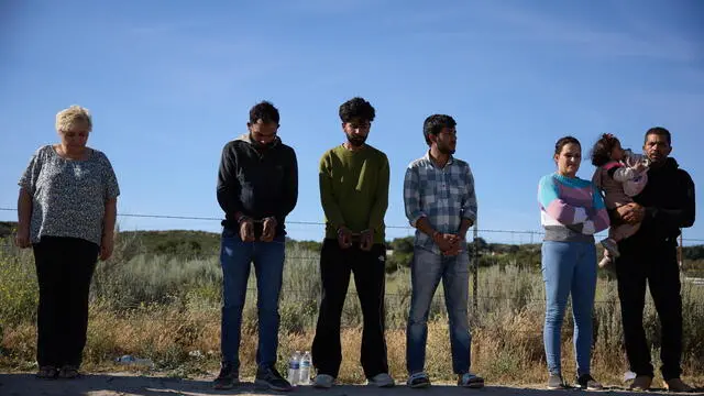 epa11390433 Migrants line up for processing and transport by US Border Patrol after crossing the US Mexico border in Jacumba, California, USA, 04 June 2024. Today, US President Joe Biden signed an executive order tightening restrictions on migrants seeking asylum at the US Mexico border. The order is expected to go into effect immediately. EPA/ALLISON DINNER