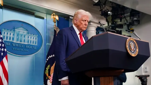 epa11864004 US President Donald Trump pauses for a moment of silence at the start of a press conference called in response to the fatal collision of a passenger airplane and a US military helicopter the previous night in Washington, DC, USA, 30 January 2025. DC Fire and EMS Chief John Donnelly said no survivors are expected following the collision of an American Eagle Flight, with 60 passengers and four crew members on board, with a US Army Black Hawk helicopter carrying three US service members late on 29 January, over the Potomac River near Reagan Washington National Airport. EPA/WILL OLIVER