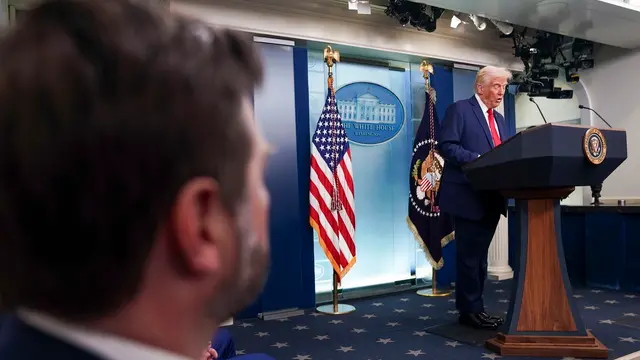 epa11864029 US Vice President JD Vance (L) looks on as US President Donald Trump (R) holds a press conference called in response to the fatal collision of a passenger airplane and a US military helicopter last night, at the White House in Washington, DC, USA, 30 January 2025. According to preliminary statements from the United States Federal Aviation Administration (FAA) and other officials, a PSA Airlines Bombardier CRJ700 regional jet, carrying 64 people, collided in midair on 29 January 2025 evening with a US Army Black Hawk helicopter, carrying three US service members, while on approach to Ronald Reagan National Airport, likely killing everyone on board. EPA/WILL OLIVER