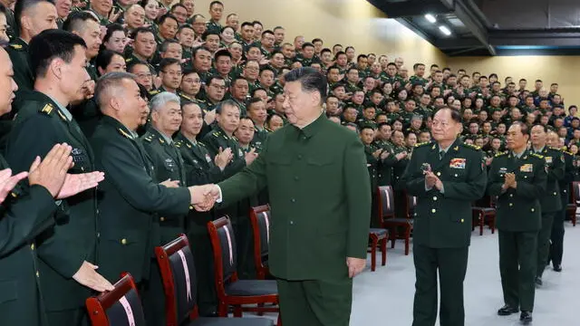 epa11759615 Chinese President Xi Jinping (C), who also serves as general secretary of the Communist Party of China Central Committee and chairman of the Central Military Commission, meets representatives during an inspection of the information support force of the Chinese People's Liberation Army (PLA) in Beijing, China, 04 December 2024 (issued 05 December 2024). EPA/XINHUA / LI GANG CHINA OUT / UK AND IRELAND OUT / MANDATORY CREDIT EDITORIAL USE ONLY