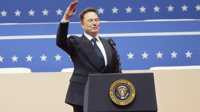 epa11840271 Tesla CEO Elon Musk gestures to the crowds at the Capitol One Arena after his address during inauguration ceremonies for US President Donald Trump in Washington, DC, USA, 20 January 2025. Trump was sworn in for a second term as president of the United States on 20 January. The presidential inauguration was held indoors due to extreme cold temperatures in DC. EPA/ALLISON DINNER