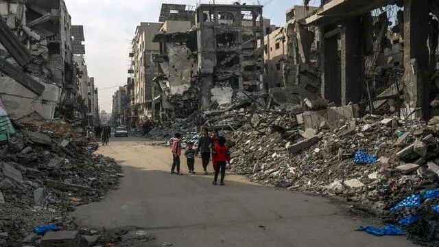 epa11858934 Palestinian children walk in the streets of Gaza City amid a ceasefire between Israel and Hamas, Gaza Strip, 28 January 2025. Israel and Hamas implemented the first phase of a hostage release and ceasefire deal on 19 January 2025. More than 46,000 Palestinians have been killed in the Gaza Strip, according to the Palestinian Ministry of Health, since Israel launched a military campaign in the strip in response to a cross-border attack led by the Palestinian militant group Hamas on 07 October 2023, in which about 1,200 Israelis were killed and more than 250 taken hostage. EPA/MOHAMMED SABER