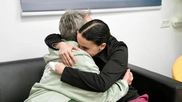 epa11837299 A handout photo made available by the Israeli army spokespersons shows the released hostage Emily Damari (R) embracing her mother Mandy (L) at a reception point near Kibbutz Reim, southern Israel, 19 January 2025. Israel and Hamas agreed on a hostage release deal and a Gaza ceasefire to be implemented on 19 January 2025. EPA/IDF SPOKESPERSON HANDOUT HANDOUT EDITORIAL USE ONLY/NO SALESHANDOUT EDITORIAL USE ONLY/NO SALES