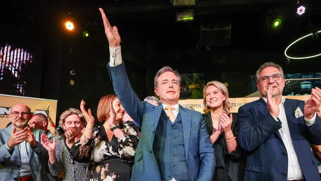 epa11657502 New Flemish Alliance (N-VA) party leader and Antwerp Mayor Bart De Wever (C) reacts after winning the municipal, provincial, and district council elections in Antwerp during an electoral evening, in Antwerp, Belgium, 13 October 2024. In Belgium, one of the few European countries where voting has traditionally been mandatory, compulsory attendance for municipal elections no longer applies to residents of the Flemish region starting this year. More than eight million Belgians are eligible to vote for their municipal and provincial councils for the next six years. EPA/OLIVIER HOSLET