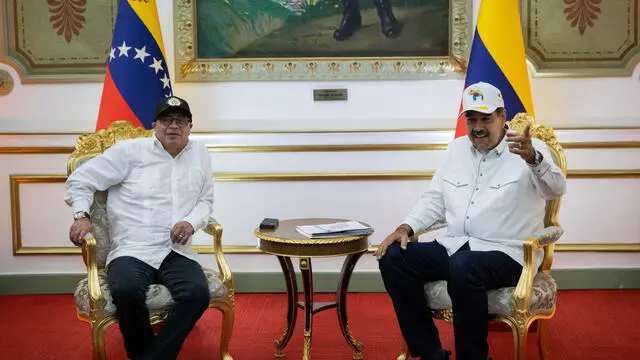 epa11268484 Colombian President Gustavo Petro (L) meets with Venezuelan counterpart Nicolas Maduro (R) at the Miraflores Palace, in Caracas, Venezuela, on 09 April 2024. The meeting was cordially held despite the recent criticism by Petro on the elections process in Venezuela, where the principal opposition leader has been unable to register. EPA/Rayner Pena R.