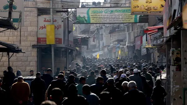 epa11772255 Palestinian mouners follow the body of Jihad Abu Salim during his funeral at the Balata refugee camp near the West Bank city of Nablus, 12 December 2024. According to the Palestinian Health Ministry Abu Salim was killed in a raid by Israeli troops early 12 December. EPA/ALAA BADARNEH