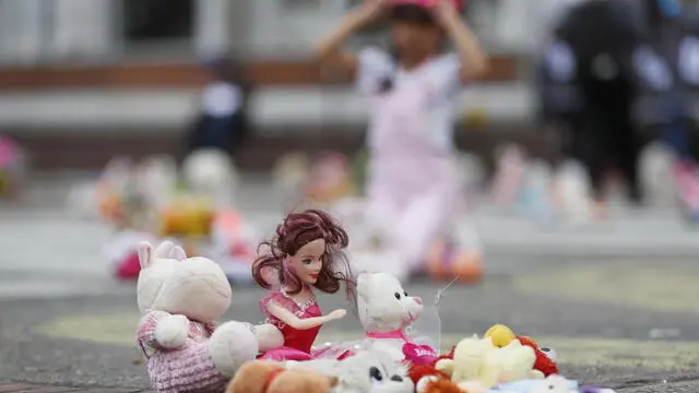 epa10321158 Toys help illustrate a story of abuse of a child, during a sit-in in the Plaza of the central 20 de Julio neighborhood, in Bogota, Colombia, 22 November 2022. Hundreds of toys were left in the church square to protest against recent cases of sexual abuse against boys and girls. This staging has been carried out for six years as part of a demonstration by the international organization Aldeas Infantiles SOS Colombia that rejects violence and sexual abuse against children. EPA/Carlos Ortega