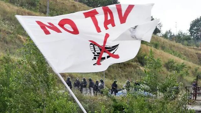 Members of NO TAV movement march during a rally towards the Chiomonte TAV worksite in Susa Valley, Piedmont Region, northern Italy, 27 July 2019. Italy would incur 'huge costs' to stop the Turin-Lyon high-speed train (TAV) link unilaterally in the face of French determination to complete the project, Italian Premier Giuseppe Conte said on 24 July, explaining his view that it would cost more to stop the TAV than to complete it. ANSA/ALESSANDRO DI MARCO