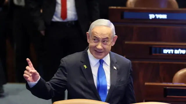 epa11770081 Israeli Prime Minister Benjamin Netanyahu gestures as he attends a special session with the President of Paraguay at the Knesset, the Israeli parliament, in Jerusalem, 11 December 2024. The Paraguayan president is on a two-day official visit to Israel, where he is scheduled to relocate his country's embassy to Jerusalem. EPA/ABIR SULTAN