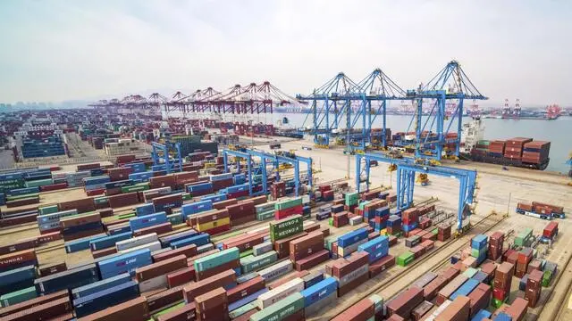 In a file picture a container port in Qingdao in eastern China's Shandong Province. .(Chinatopix via AP) [CopyrightNotice: Chinatopix]