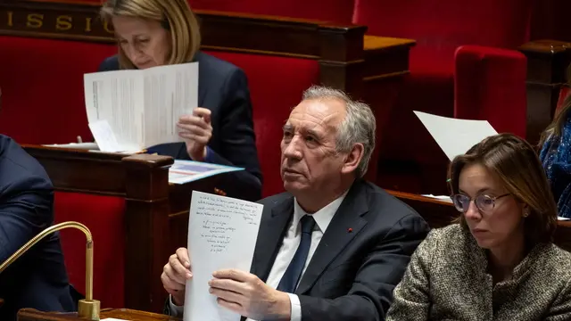 epa11877160 French Prime Minister Francois Bayrou (C) attends a session of no-confidence vote against the government at the National Assembly in Paris, France, 05 February 2025. The no-confidence vote came after the French prime minister activated Article 49.3 of the Constitution on 03 February to pass his budget bill without a vote. EPA/CHRISTOPHE PETIT TESSON