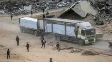 epa11844699 A humanitarian aid truck drives through destroyed buildings amid a ceasefire between Israel and Hamas, in the east of Rafah, southern Gaza Strip, 22 January 2025. According to the UN, hundreds of humanitarian aid trucks have entered the Gaza Strip since Israel and Hamas implemented the first phase of a hostage release and ceasefire deal on 19 January 2025. EPA/MOHAMMED SABER