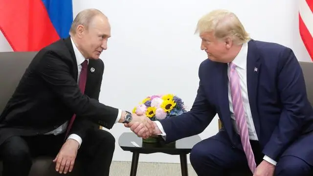 epa07679922 A handout picture made available on official website of President of Russia, shows Russian President Vladimir Putin (L) shaking hands with US President Donald J. Trump (R) during their meeting on the sidelines of the G20 summit in Osaka, Japan, 28 June 2019. In the first time Japan hosts a G20 summit. The summit gathers leaders from 19 countries and the European Union to discuss topics such as global economy, trade and investment, innovation and employment. EPA/RUSSIAN PRES. PRESS OFFICE / HANDOUT HANDOUT EDITORIAL USE ONLY/NO SALES