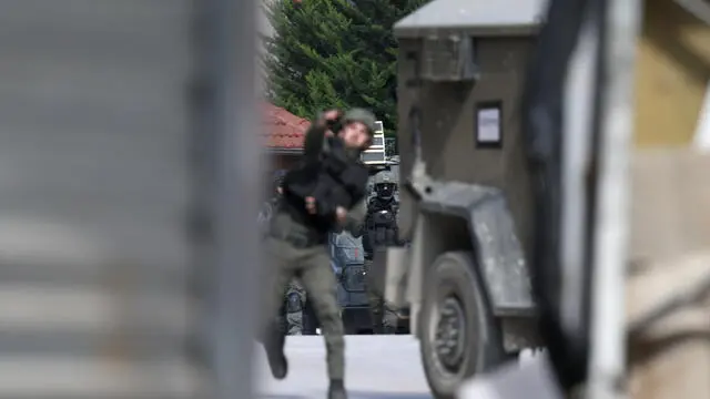 epa11857940 Isareli troops on the second day of an Israeli military raid at Tulkarem refugee camp, near the West Bank city of Tulkarem, 28 January 2025. At least two Palestinians were killed and a dozen injured in the Israeli military raid in Tulkarem and its camp, according to the Palestinian Ministry of Health. EPA/ALAA BADARNEH