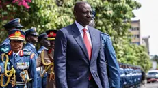 epa11733094 Kenyan President William Ruto (C) inspects a guard of honor mounted by Kenya Air Force officers upon his arrival at the Parliament building for his annual State of the Nation address, in Nairobi, Kenya, 21 November 2024. During his address, the president announced the canceling of the recently signed 30-year deal with India's Adani Group Adani, including ongoing plans for Adani's takeover of the Nairobi's Jomo Kenyatta International Airport (JKIA), citing 'new information provided by partner nations' following the indictment of its founder in the United States on bribery and fraud charges. EPA/DANIEL IRUNGU