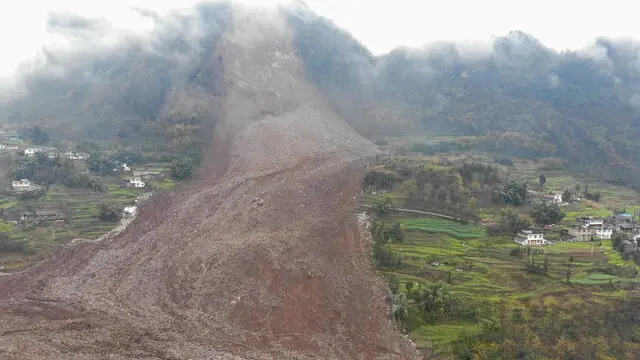 epa11882463 The site of a landslide in Jinping Village, Junlian County, in the city of Yibin, southwest China's Sichuan Province, 08 February 2025. Southwest China's Sichuan Province upgraded its geological disaster emergency response after a landslide buried 10 houses and left over 30 people missing. Two people were rescued in the afternoon, and rescue efforts are ongoing. EPA/XINHUA / Jiang Hongjing CHINA OUT / UK AND IRELAND OUT / MANDATORY CREDIT EDITORIAL USE ONLY