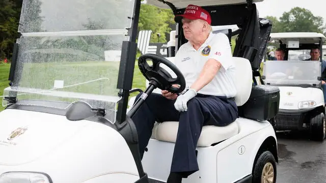 epa10793627 Former US President Donald J. Trump participates in a Pro-Am tournament leading up to the upcoming LIVGolf tournament at Trump National Golf Club Bedminster in Bedminster, New Jersey, USA, 10 August 2023. Trump on 10 August virtually pleaded not guilty to additional criminal charges in the case against him for allegedly illegally keeping secret national security documents after leaving office. EPA/JUSTIN LANE