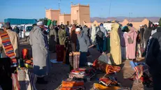 epa11733566 A carpet seller waits for customers at the weekly market in Taznakht, Ouarzazate province, Moroccoa, 21 November 2024, during the seventh edition of the Ait Ouaouzguit Carpet Festival running from 20 to 24 November under the theme 'The Ait Ouaouzguit Carpet: Between Tourism Valorization and Socio-Economic Empowerment of Women Weavers.' The region in south-eastern Morocco is famous for producing Ouzguit carpets, named after the Ait Ouzguit tribes, which are Berber tribes that inhabited the southern slopes of the High Atlas Mountains. EPA/JALAL MORCHIDI