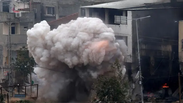 epa11884614 Smoke billows following an explosion during an Israeli military operation in the Nur Shams refugee camp near the West Bank city of Tulkarem, 09 February 2025. According to the Palestinian Ministry of Health, at least two Palestinian women, one of whom pregnant, were killed in the operation. EPA/ALAA BADARNEH