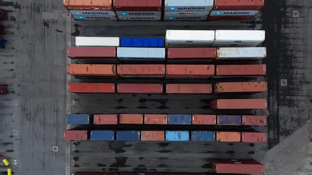 epa11880925 An aerial photograph taken with a drone of containers stacked at Seaforth Dock container terminal in Liverpool, Britain, 07 February 2025. US President Donald Trump has imposed 10 percent tariffs on China, with planned tariffs on Mexico and Canada being delayed after last minute talks. The US President has said that tariffs may also be imposed on the EU and the UK, which exports goods and services including energy, cars, machinery and pharmaceuticals to the US. EPA/ADAM VAUGHAN