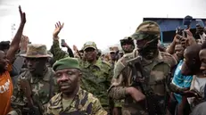 epa11878808 M23 armed group spokesperson Willy Ngoma (C) raises his hand as he arrives at a meeting called by the M23 group at the Stade de l'Unite (Unity Stadium) in Goma, North Kivu, Democratic Republic of Congo, 06 February 2025. The M23 (March 23 Movement) appointed Joseph Bahati Musanga as the new governor of North Kivu province, after its rebels claimed to have captured the city of Goma in late January 2025.The United Nations said that nearly 3,000 people have been killed in fighting between the M23 armed group and the Armed Forces of the Democratic Republic of the Congo (FARDC). EPA/MARIE JEANNE MUNYERENKANA