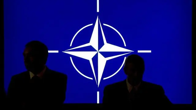 epa04384140 Participants sit in front of the Nato logo during the NATO summit in Newport, South Wales, 04 September 2014. World leaders from about 60 countries are coming together for a two-day NATO summit taking place from 04-05 September 2014. EPA/MAURIZIO GAMBARINI