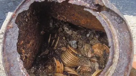 epa04100700 An undated handout photograph provided by Kagin's, Inc. on 25 February 2014 shows a can of gold coins that is part of a collection of coins found buried on private property in California's gold region, USA. A California couple has stumbled onto cache of gold coins worth 10 million dollars (7.3 million euros) buried in their back yard in, the San Francisco Chronicle reported 25 February 2014. The couple, who wish to remain anonymous, found the 19th century US coins - believed to be the largest such find in US history - while walking with their dog on their property last year, the report said. They noticed the top of a rusty tin can protruding from the ground, dug it up and took it home. The coins dated from 1847 to 1894 and many were in mint condition having never been circulated. They had a face value of 27,980 dollars but are expected to fetch more than 10 million when put up for sale by auction in May, the report quoted coin experts as saying. EPA/KAGIN'S INC. / HANDOUT EDITORIAL USE ONLY / NO SALES HANDOUT EDITORIAL USE ONLY/NO SALES