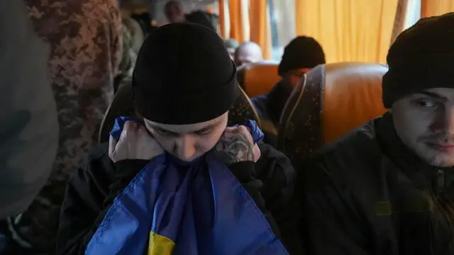 epa11877039 Ukrainian prisoners of war (POWs) react following a prisoner swap, at an undisclosed location in Ukraine, 05 February 2025, amid the Russian invasion. The Ukrainian government announced on 05 February that Ukraine managed to swap 150 Ukrainian prisoners from Russian captivity in exchange for the same amount of Russian prisoners. EPA/STR