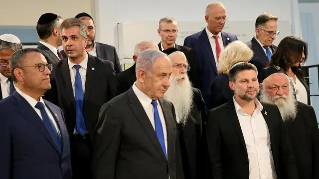 epa11391403 Israeli Prime Minister Benjamin Netanyahu (C) poses next to Minister of Finance Bezalel Smotrich (2-R) and other cabinet members prior to a cabinet meeting at the Bible Lands Museum in Jerusalem, 05 June 2024. EPA/GIL COHEN-MAGEN / POOL