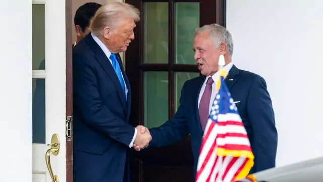 epa11888965 US President Donald J. Trump (L) shakes hands with Jordan's King Abdullah II as he departs following meetings at the White House in Washington, DC, USA, 11 February 2025. During their meeting President Trump again suggested that Gaza could be emptied of residents, controlled by the U.S. and redeveloped as a tourist area. EPA/SHAWN THEW