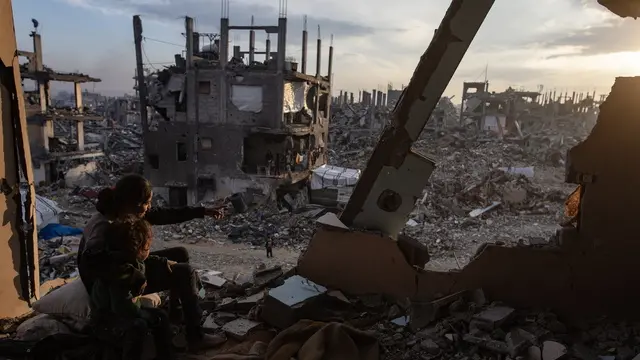 epaselect epa11888850 Palestinian youth watch the sunset from their destroyed house in the Jabalia camp, north of Gaza City, 11 February 2025. Israel and Hamas implemented the first phase of a hostage release and ceasefire deal on 19 January 2025. More than 48,000 Palestinians have been killed in the Gaza Strip, according to the Palestinian Ministry of Health, since Israel launched a military campaign in the strip in response to a cross-border attack led by the Palestinian militant group Hamas on 07 October 2023, in which about 1,200 Israelis were killed and more than 250 taken hostage. EPA/HAITHAM IMAD