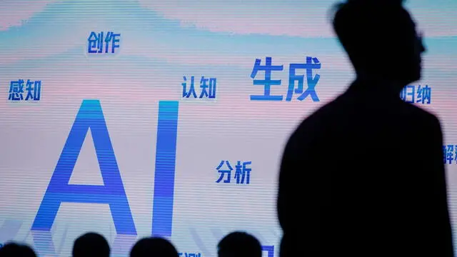 epa10922888 People attend a forum about artificial intelligence during the Baidu 'Prompt the World' artificial intelligence event at the Shougang Park in Beijing, China, 17 October 2023. Baidu unveiled multiple artificial intelligence native applications such as Ernie Bot 4.0, the ChatGPT equivalent language model and offered insights on new opportunities through AI-native thinking in collaboration with enterprises, users, and partners. EPA/MARK R. CRISTINO