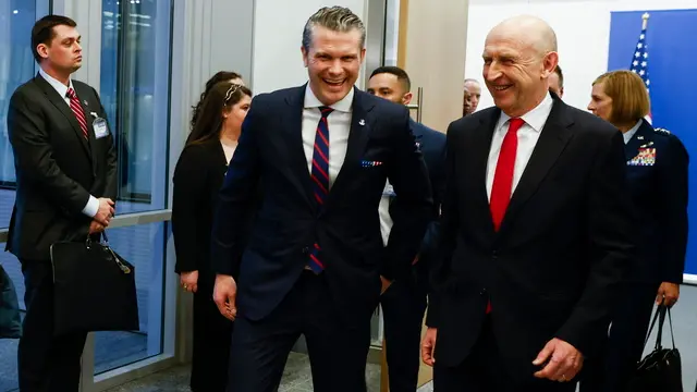 epa11889865 US Defense Secretary Pete Hegseth (C) meets with British Defense Secretary John Healey (R), on the eve of a North Atlantic Treaty Organization (NATO) defense ministers' meeting at the alliance's headquarters in Brussels, Belgium, 12 February 2025. EPA/Johanna Geron / POOL