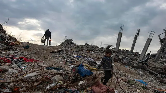 epa11888769 A Palestinian child walks past destroyed houses in the Jabalia camp, north of Gaza City, 11 February 2025. Israel and Hamas implemented the first phase of a hostage release and ceasefire deal on 19 January 2025. More than 48,000 Palestinians have been killed in the Gaza Strip, according to the Palestinian Ministry of Health, since Israel launched a military campaign in the strip in response to a cross-border attack led by the Palestinian militant group Hamas on 07 October 2023, in which about 1,200 Israelis were killed and more than 250 taken hostage. EPA/HAITHAM IMAD