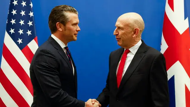 epa11889866 US Defense Secretary Pete Hegseth (L) shakes hands with British Defense Secretary John Healey (R), on the eve of a North Atlantic Treaty Organization (NATO) defense ministers' meeting at the alliance's headquarters in Brussels, Belgium, 12 February 2025. EPA/Johanna Geron / POOL