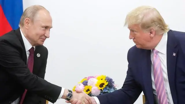 epa07679921 A handout picture made available on official website of President of Russia, shows Russian President Vladimir Putin (L) shaking hands with US President Donald J. Trump (R) during their meeting on the sidelines of the G20 summit in Osaka, Japan, 28 June 2019. In the first time Japan hosts a G20 summit. The summit gathers leaders from 19 countries and the European Union to discuss topics such as global economy, trade and investment, innovation and employment. EPA/RUSSIAN PRES. PRESS OFFICE / HANDOUT HANDOUT EDITORIAL USE ONLY/NO SALES