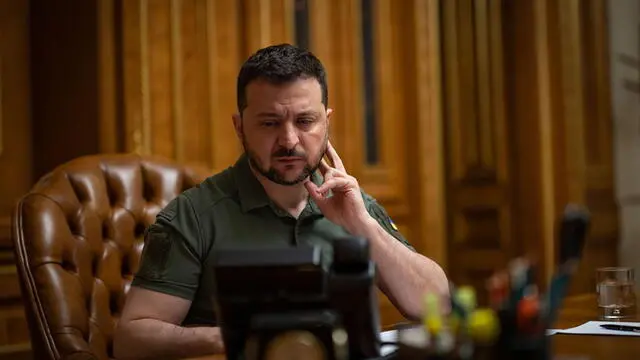 epa10592879 A handout photo made available by Ukraine's Presidential Press Service shows Ukrainian President Volodymyr Zelensky talking on the phone to the Chinese president (not pictured), Kyiv, Ukraine, 26 April 2023. Volodymyr Zelenskyy had a phone call with the President of the People's Republic of China Xi Jinping about bilateral relations, the presidential office said. Special attention was paid to the ways of possible cooperation to establish peace for Ukraine. EPA/PRESIDENTIAL PRESS SERVICE HANDOUT HANDOUT EDITORIAL USE ONLY/NO SALES