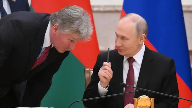 epa11760446 Russian President Vladimir Putin (R) speaks with Russian Presidential Spokesman Dmitry Peskov (L) during the signing ceremony of documents following a meeting of the Supreme State Council of the Union State of Russia and Belarus, in Minsk, Belarus, 06 December 2024. The meeting marks the 25th anniversary of the Treaty on the Creation of the Union State. EPA/GRIGORY SYSOYEV / SPUTNIK / KREMLIN POOL