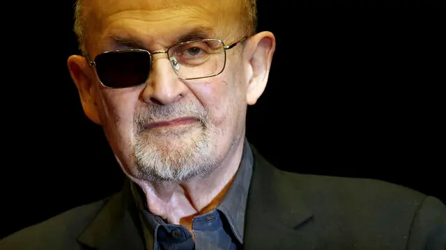 epa11345648 Indian-born British-American novelist Salman Rushdie poses during a photocall at the theatre 'Deutsches Theater', in Berlin, Germany, 16 May 2024. Rushdie is visiting Berlin to present his memoir 'Knife: Meditations After an Attempted Murder' about the on-stage attack that almost claimed his life in 2022, and caused him to lose sight in his right eye. EPA/HANNIBAL HANSCHKE